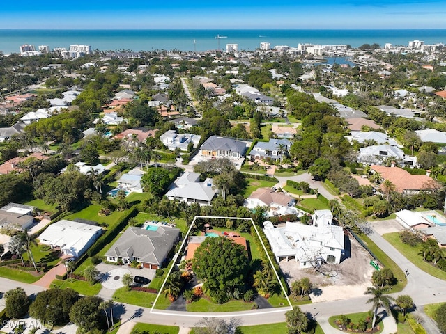 bird's eye view featuring a water view and a residential view