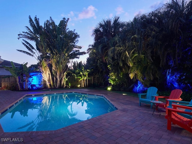 view of pool with a patio area, fence, and a fenced in pool