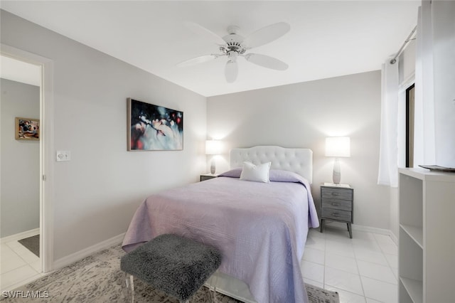 bedroom featuring a ceiling fan, baseboards, and tile patterned floors