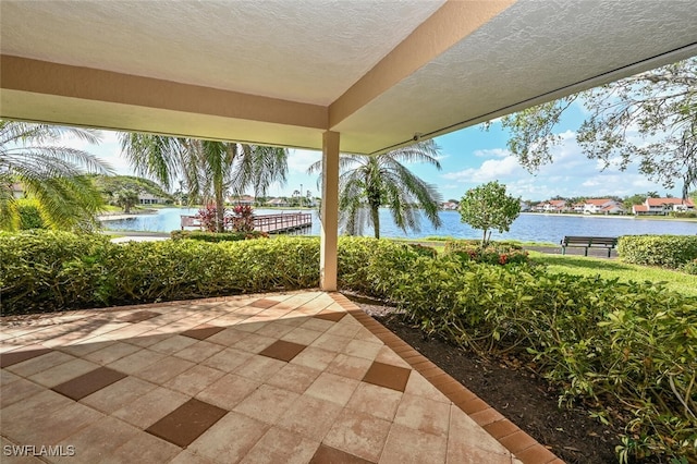 view of patio featuring a water view