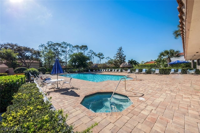 pool featuring a patio and a community hot tub