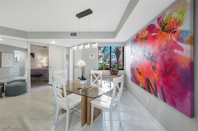 dining room with tile patterned flooring, visible vents, and baseboards