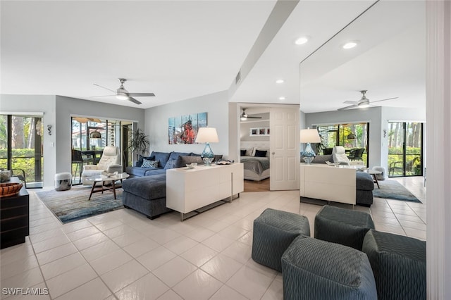 living area with a healthy amount of sunlight, recessed lighting, ceiling fan, and light tile patterned flooring