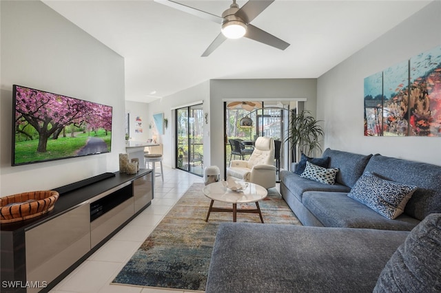 living area featuring ceiling fan and light tile patterned flooring