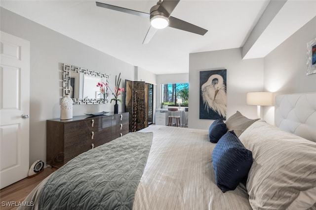 bedroom featuring a ceiling fan and wood finished floors