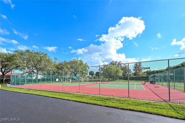 view of sport court featuring fence