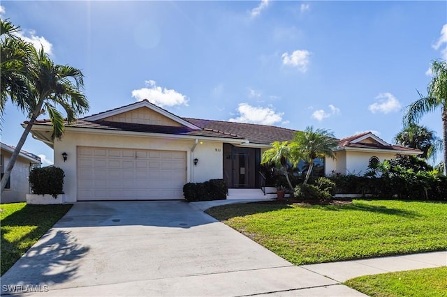 ranch-style home featuring a garage and a front lawn