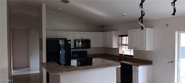 kitchen with white cabinets, black appliances, lofted ceiling, and a sink