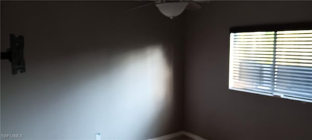 unfurnished room featuring a ceiling fan