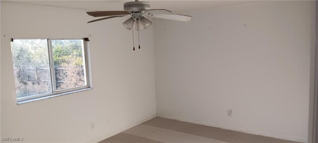 764 Chapman Ave S, Lehigh Acres, FL 33974 - empty room featuring baseboards and a ceiling fan
