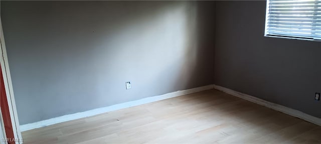 764 Chapman Ave S, Lehigh Acres, FL 33974 - unfurnished room featuring light wood finished floors and baseboards