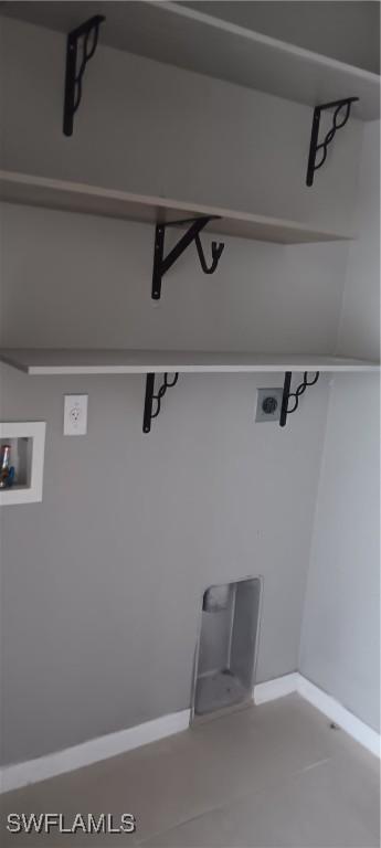 764 Chapman Ave S, Lehigh Acres, FL 33974 - clothes washing area featuring baseboards, laundry area, and washer hookup