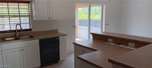 764 Chapman Ave S, Lehigh Acres, FL 33974 - kitchen featuring white cabinetry, light tile patterned flooring, a sink, and dishwasher