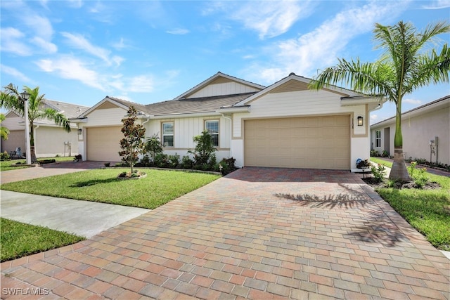 ranch-style home with a front lawn and a garage