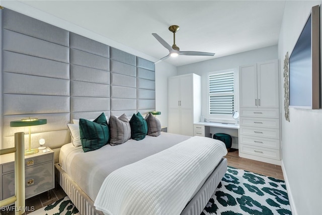 bedroom featuring dark hardwood / wood-style floors and ceiling fan