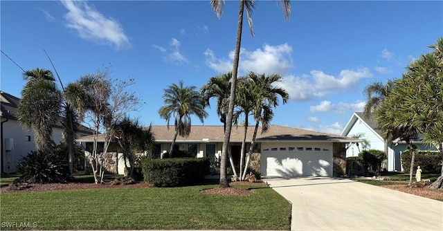 single story home featuring a front lawn and a garage