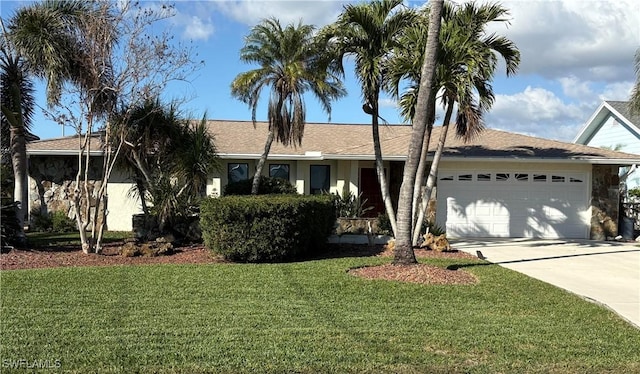 single story home with a front yard and a garage