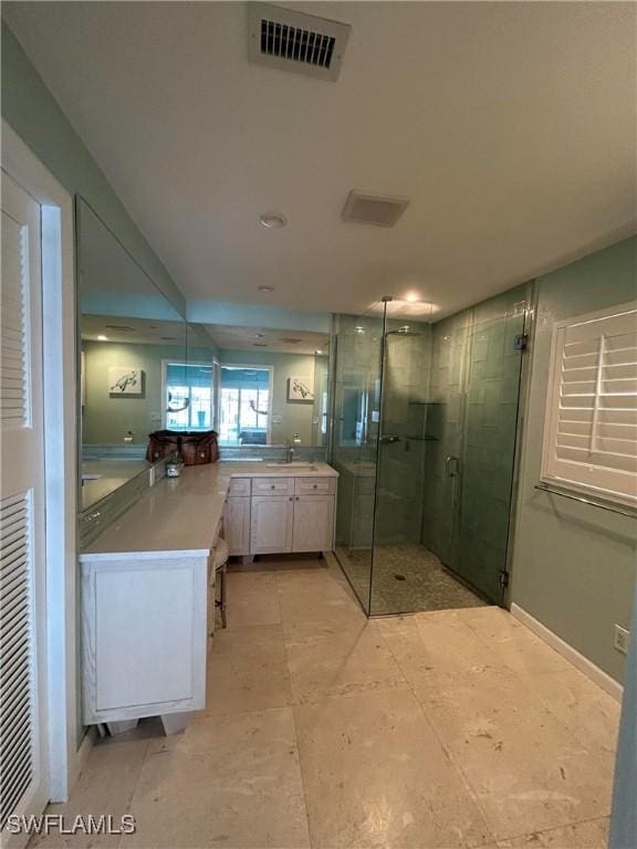 bathroom with vanity and an enclosed shower