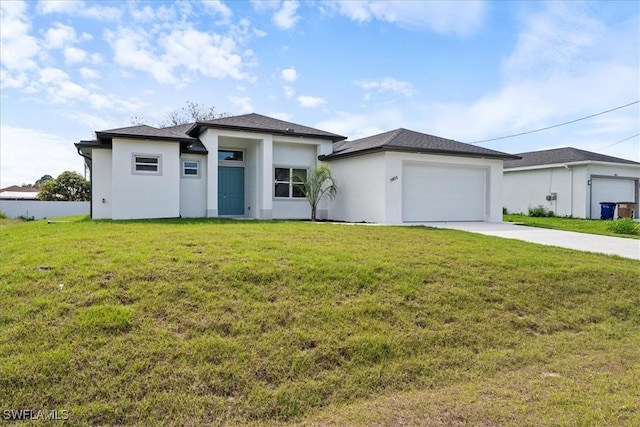 prairie-style home with a garage and a front yard