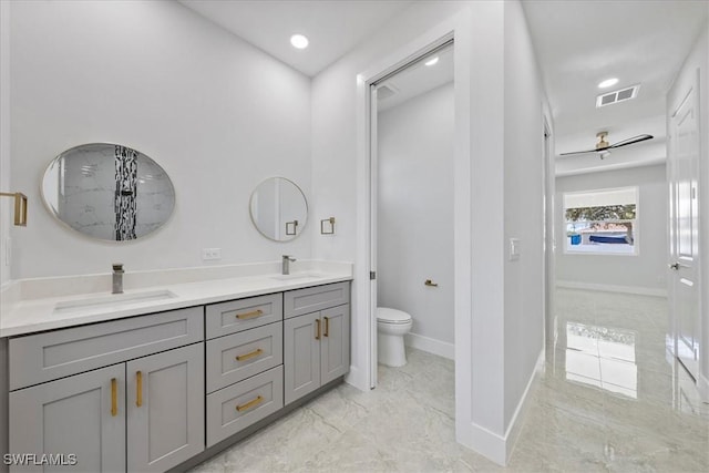 bathroom featuring vanity and toilet