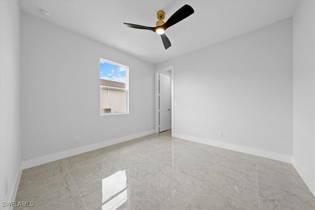 spare room with ceiling fan