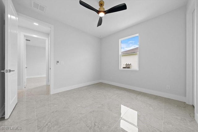unfurnished room with ceiling fan