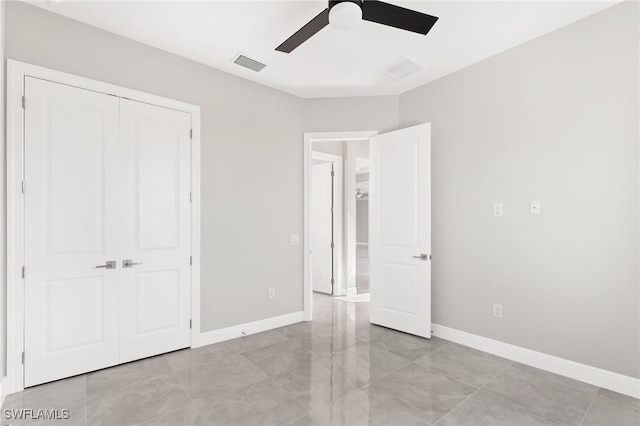 unfurnished bedroom featuring a closet and ceiling fan