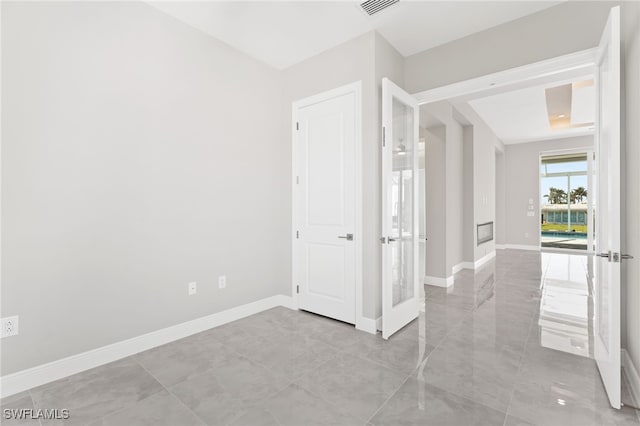 spare room with french doors