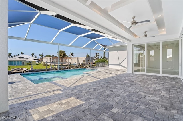 view of swimming pool with a patio, ceiling fan, and a lanai