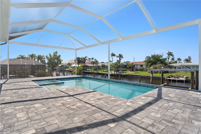 view of swimming pool with a water view, a lanai, and a patio