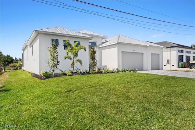 view of front of home featuring a garage and a front yard