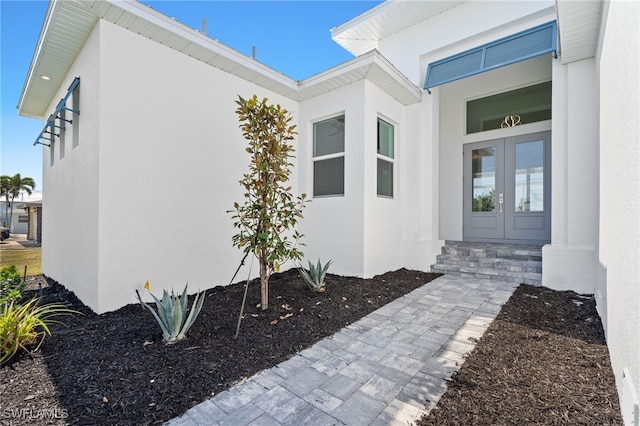 property entrance featuring french doors