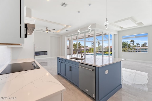 kitchen featuring hanging light fixtures, a tray ceiling, sink, stainless steel dishwasher, and black electric stovetop