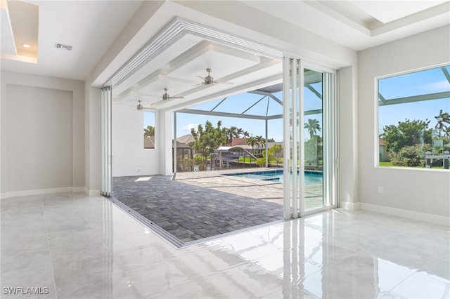 entryway with a tray ceiling