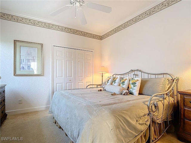 bedroom featuring a closet, carpet flooring, a ceiling fan, and baseboards