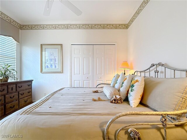 bedroom featuring ornamental molding, a closet, and ceiling fan