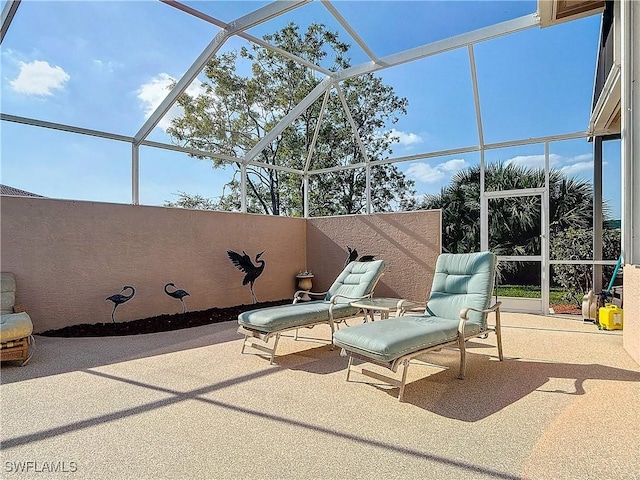 view of patio with a lanai