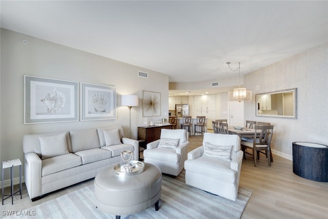 living room with light hardwood / wood-style floors