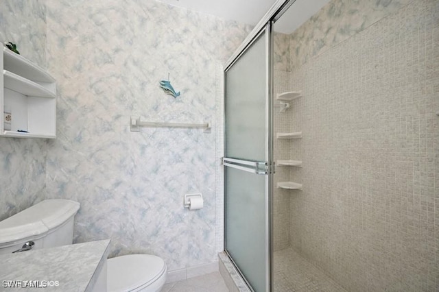 2228 Poinciana Dr, Naples, FL 34105 - bathroom featuring toilet, vanity, a stall shower, and tile patterned floors