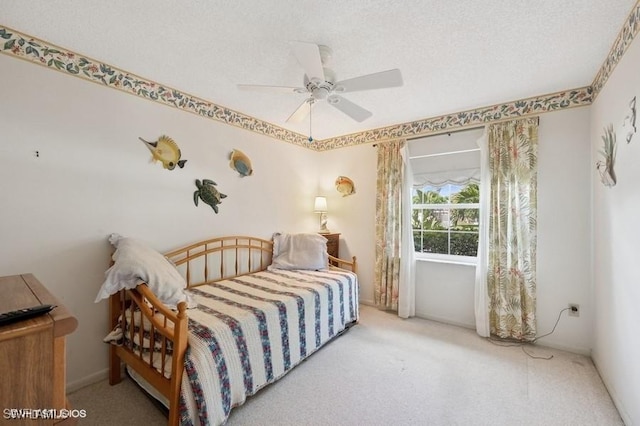 2228 Poinciana Dr, Naples, FL 34105 - bedroom featuring carpet flooring, a textured ceiling, and ceiling fan