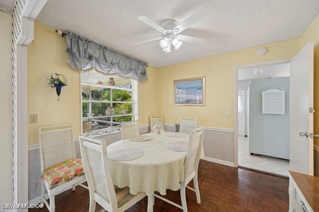 2228 Poinciana Dr, Naples, FL 34105 - dining area with a ceiling fan and a textured ceiling