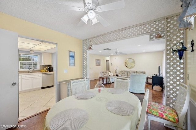 2228 Poinciana Dr, Naples, FL 34105 - dining room featuring a textured ceiling, visible vents, ceiling fan, and light tile patterned floors