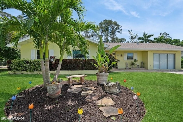 2228 Poinciana Dr, Naples, FL 34105 - view of front of house with a front yard and stucco siding