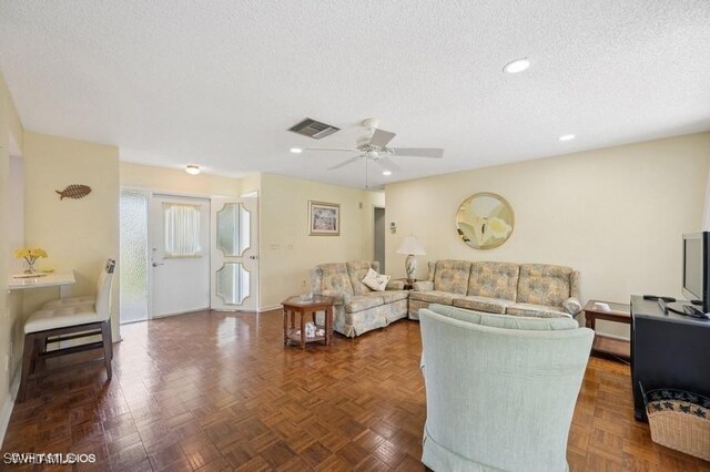 2228 Poinciana Dr, Naples, FL 34105 - living area with recessed lighting, a textured ceiling, ceiling fan, and visible vents