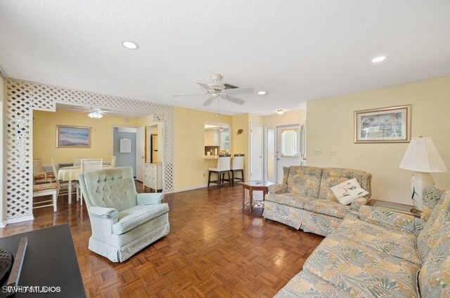 2228 Poinciana Dr, Naples, FL 34105 - living room featuring baseboards, a textured ceiling, ceiling fan, and recessed lighting