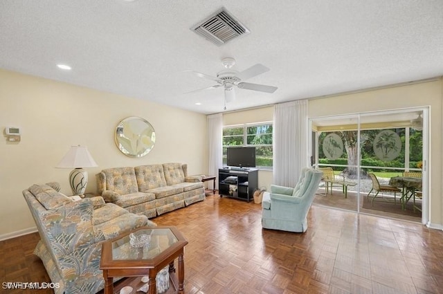 2228 Poinciana Dr, Naples, FL 34105 - living room featuring a textured ceiling, visible vents, baseboards, recessed lighting, and a ceiling fan