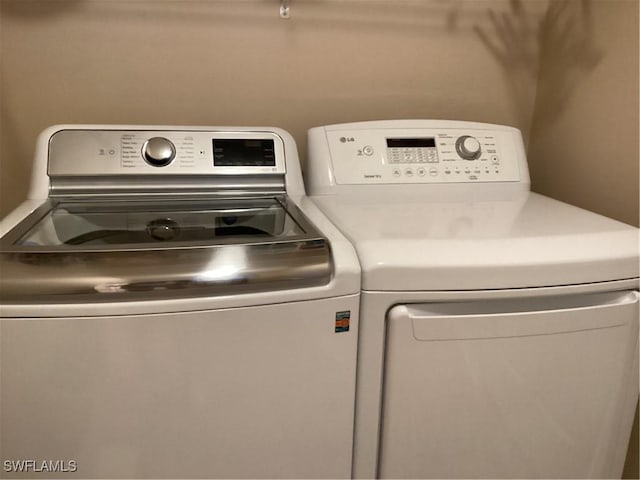 8528 Brittania Dr, Fort Myers, FL 33912 - washroom featuring washing machine and clothes dryer