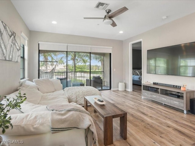 living room with recessed lighting, visible vents, ceiling fan, and light wood finished floors