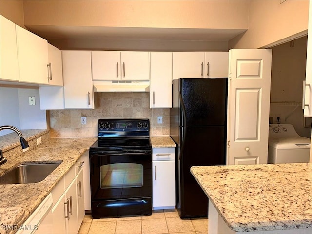 kitchen with white cabinets, washer / dryer, sink, and black appliances