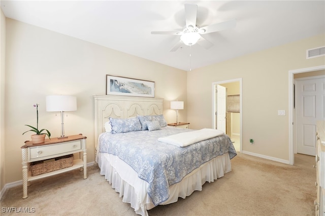 bedroom featuring baseboards, visible vents, a ceiling fan, and light colored carpet